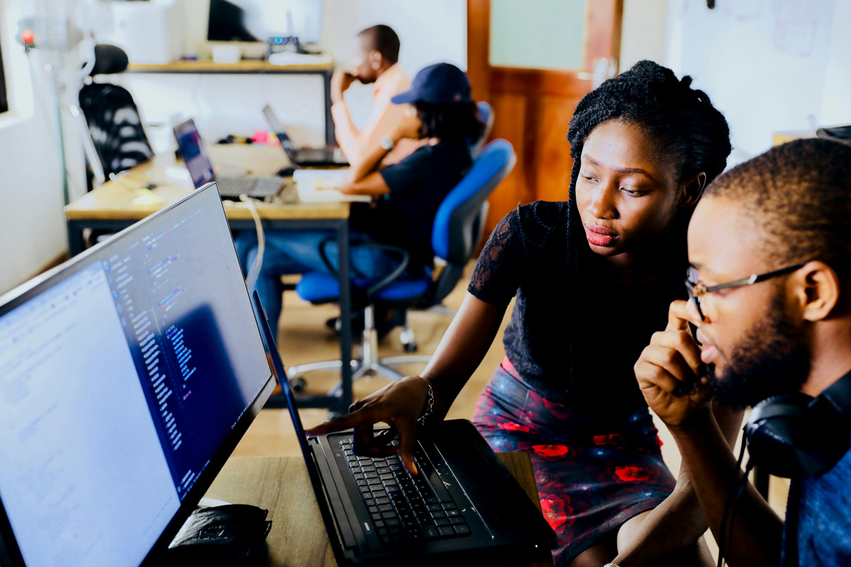 Two people looking at computer