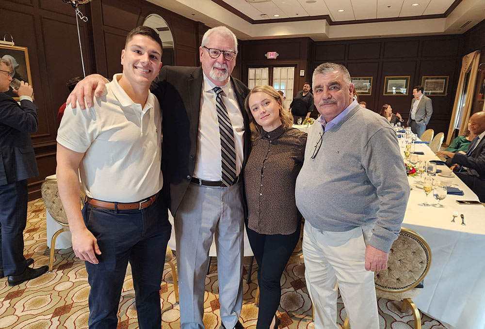 Group photo of PE Systems team celebrating Jack Grady's retirement