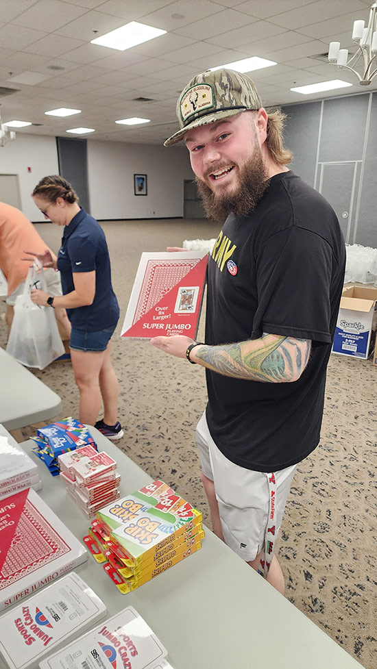 PE Systems intern, Jacob, packing bags for a community service event.