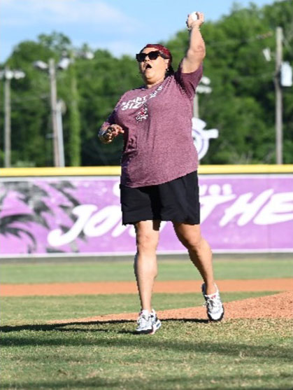 PE Systems CEO, Marissa King, throwing the first pitch