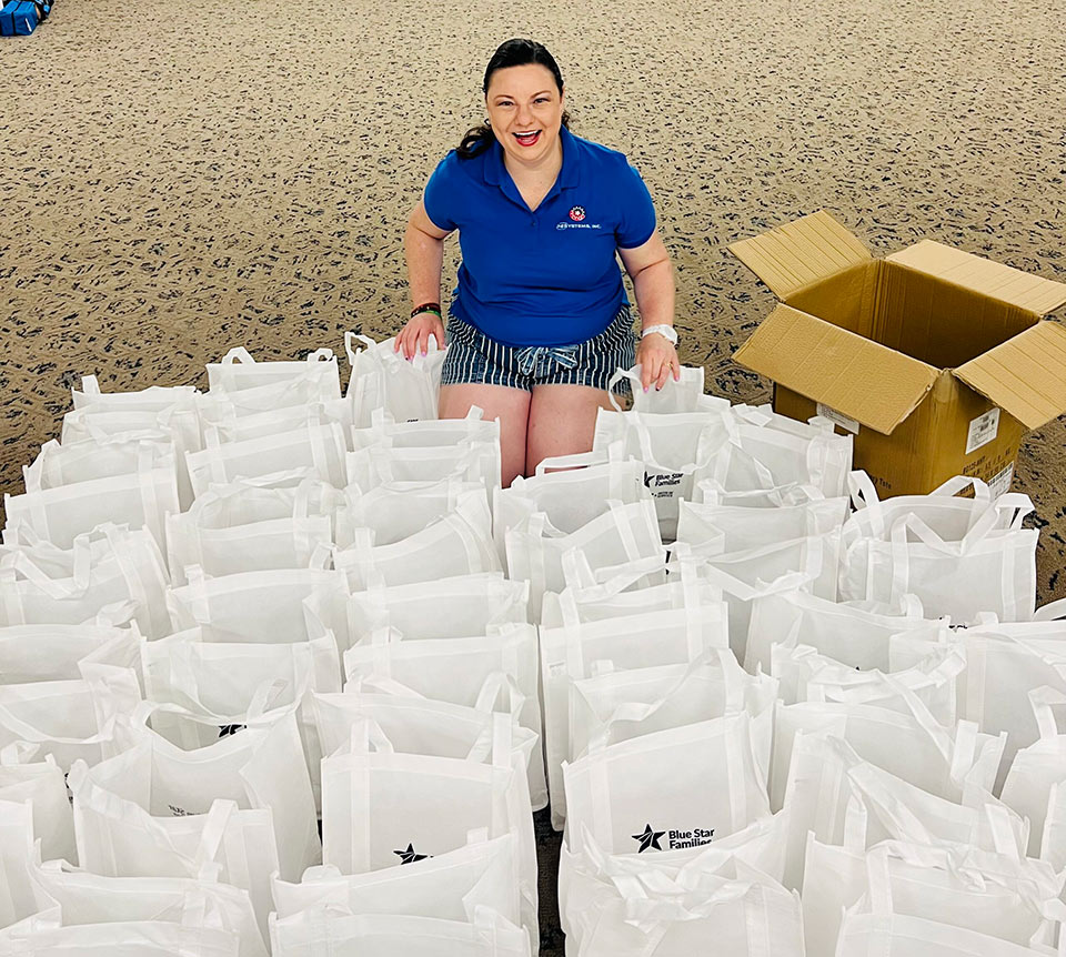 PE Systems volunteer with donation bags