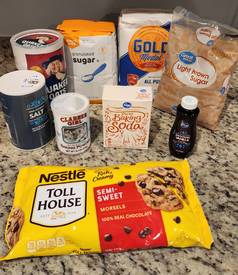 A counter-top full of ingredients to make chocolate chip cookies