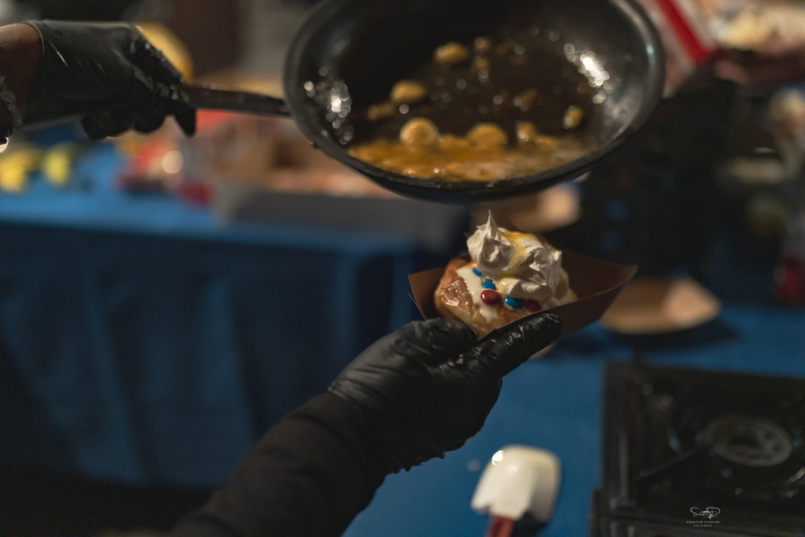 A close up of sweet treats being prepared at the 2024 PE Systems holiday party